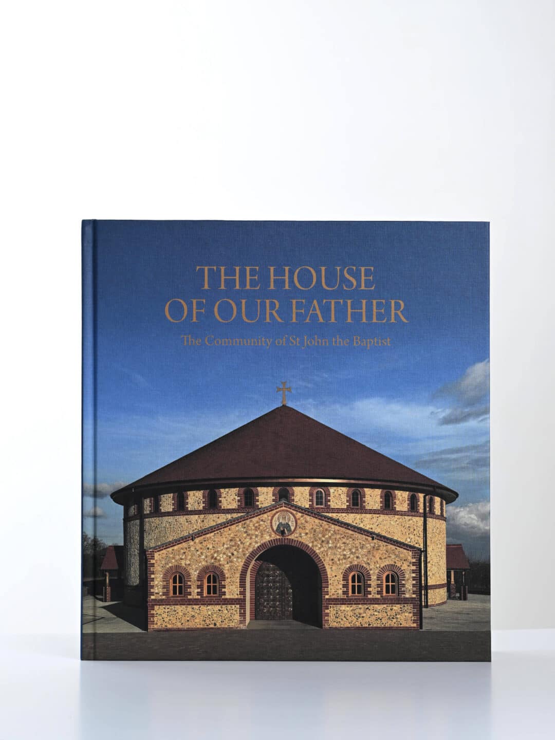 The House of Our Father book cover, featuring a circular building with a cross on top.